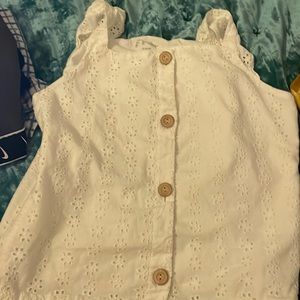White blouse and cream brown buttons on the shirt